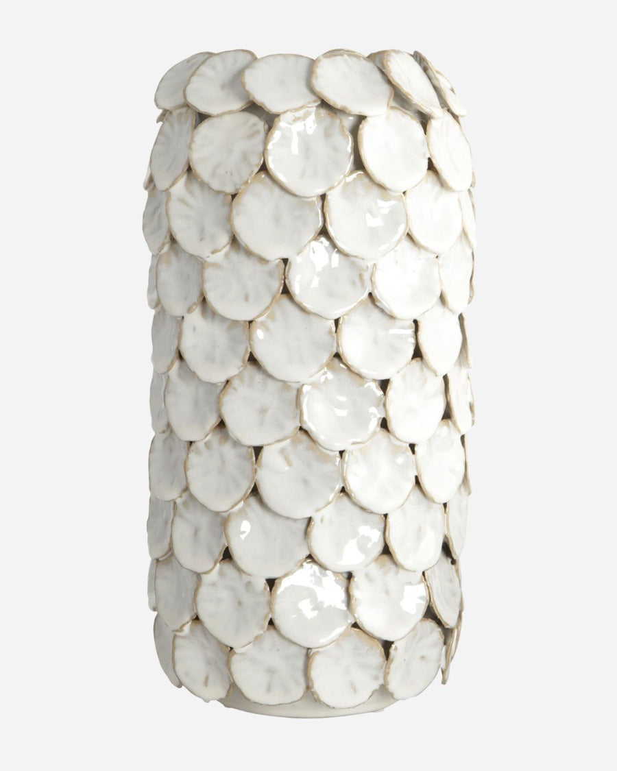 vase is designed with circular 'dots' that create a shield around the vase, which gives the vase a unique and sculptural look. Use it as a design statement in your home on its own, or arrange with cut flowers for a different appearance.
