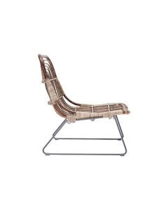 This streamlined chair is the best place to rest after a long day of work. Sheepskin or pillows and other items are not needed for softening. The natural rattan seat with thin metal legs has an airy effect. Equally beautiful in the living room and on the terrace in summer.